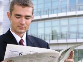pic of newspaper  - businessman reading newspaper - JPG 
