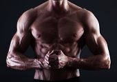 foto of muscle  - Muscular male torso with lights showing muscle detail isolated - JPG 
