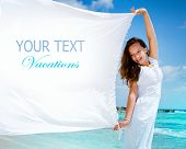 stock photo of beach  - Beautiful Girl With White Scarf on The Beach - JPG 