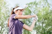 foto of golf  - Woman playing golf - JPG 