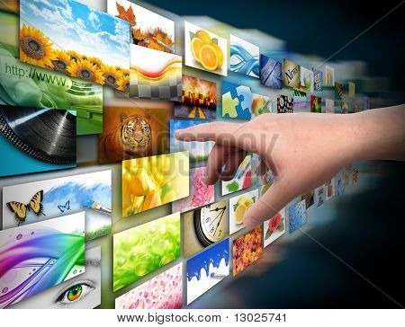 Picture or Photo of A hand is reaching out and touching a media technology gallery with image photos on a black background. Use it for an internet streaming concept or a communication theme.