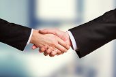 foto of handshake  - Closeup of a business hand shake between two colleagues - JPG 