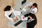 stock photo of meeting  - Overhead view of business meeting - JPG 