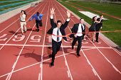 stock photo of competition  - Businesspeople crossing the finish line - JPG 