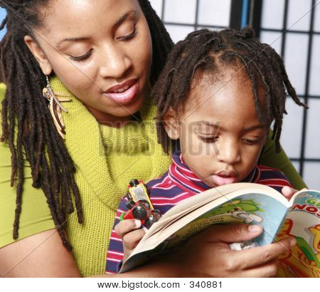 Picture or Photo of Mother reading to her son
