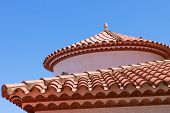 stock photo of tiles  - Small statue of an egg on the red tiled roof - JPG 