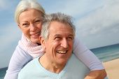 picture of beach  - Happy senior couple at the beach - JPG 