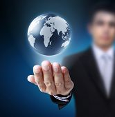 foto of globe  - holding a glowing earth globe in his hands - JPG 