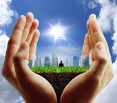 picture of buildings  - person holding a business - JPG 