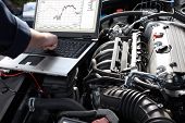 stock photo of technology  - Professional car mechanic working in auto repair service - JPG 