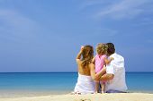 stock photo of beach  - Portrait of young family having fun on the beach - JPG 