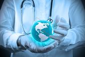 pic of medical  - Medical Doctor holding a world gobe in her hands as medical network - JPG 