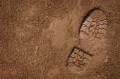 image of earth  - Imprint of the shoe on mud with copy space - JPG 