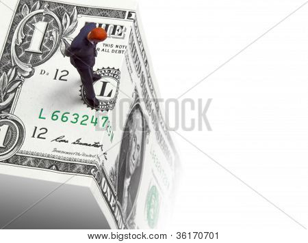Picture or Photo of Conceptual image of a figure looking over a money cliff illustrating economic uncertainty.