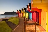 stock photo of hut  - Beach huts at sunrise in Great Britain - JPG 