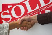 foto of handshake  - business people seal contract for sale with a handshake - JPG 