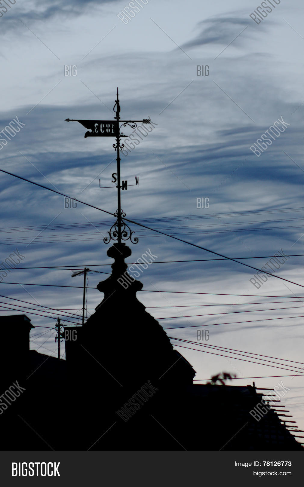 Old Wind Vane On Top Of A Gothic Building Stock Photo & Stock Images