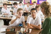 picture of science  - Students performing science experiments in classroom - JPG 
