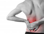 picture of health  - Rear view of a young man holding his back in pain isolated on white background monochrome photo with red as a symbol for the hardening - JPG 