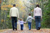 pic of family  - a family walking together through the woods in october - JPG 