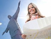 pic of map  - Happy woman traveling to Rio de Janeiro and holding a map - JPG 