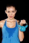 stock photo of fitness  - Fitness exercise woman holding kettlebell strength training biceps - JPG 
