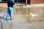 picture of pressure  - Crew Member Cleans The Painted Street Markings - JPG 