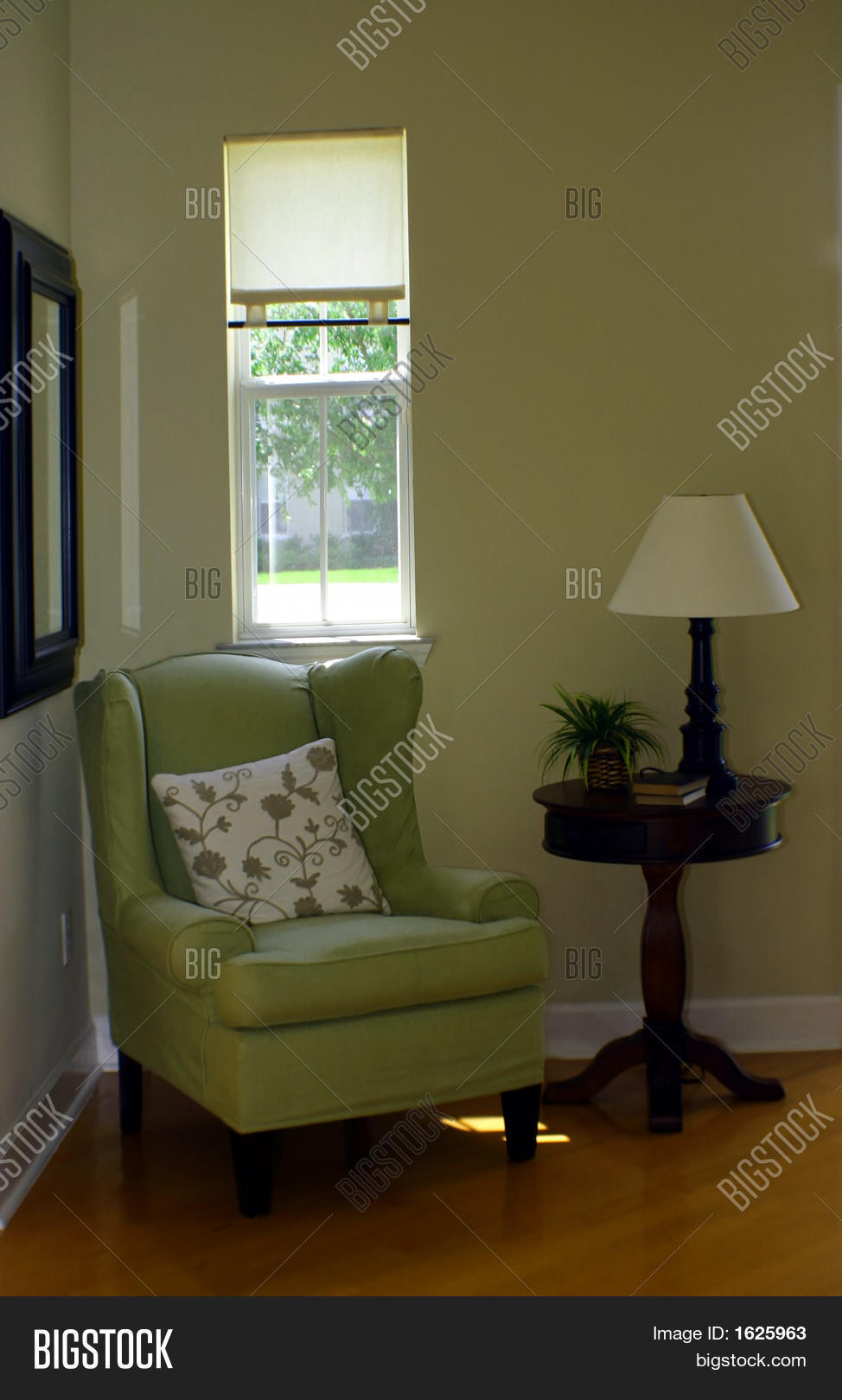 Green wingback chair and lamp in foyer stock photo & stock images ...