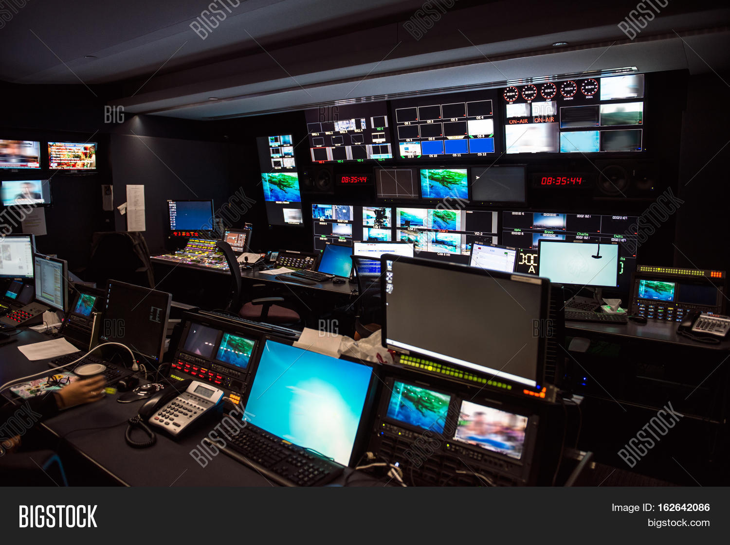 TV Broadcast news studio with many computer screens and control panels