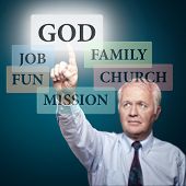 stock photo of religion  - Senior pastor showing the priorities in our life - JPG 