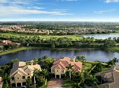 stock photo of golf  - Aerial photograph of a Florida community with private golf course in the distance - JPG 