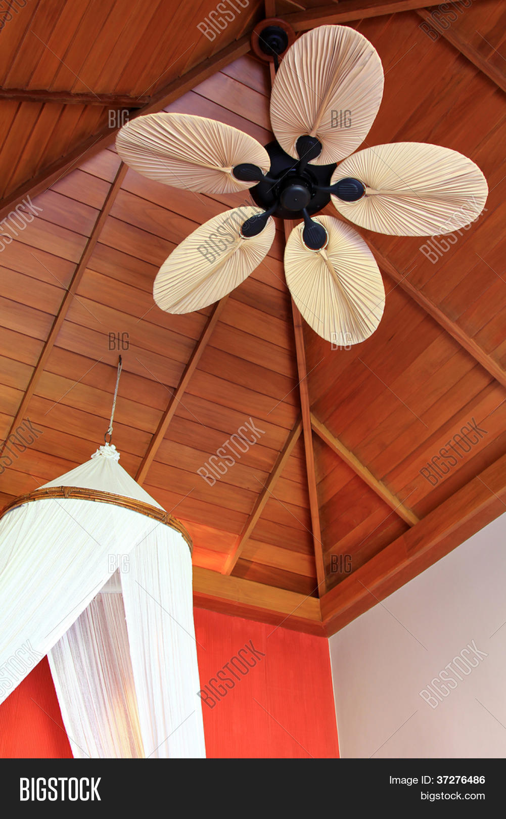A Room Decorated With Asian Style Palm Leaf Shaped Ceiling A Room Decorated With Asian Style Palm Leaf Shaped Ceiling Fan Blade