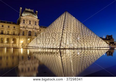 Picture or Photo of The Pyramid-entrance near to the Louvre Museum in Paris France. Illumination project was developed by the American designer Claude Engl who has established halogen lamps on internal perimeter of a pyramid.