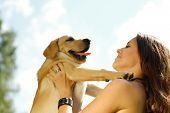 foto of dog  - Girl with her dog resting outdoors - JPG 