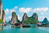 image of rocks  - Floating village and rock islands in Halong Bay Vietnam Southeast Asia - JPG 