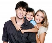 picture of family  - Happy young family with pretty child posing on white background - JPG 