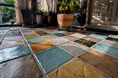 picture of tiles  - Colorful tile plunch on the floor in a living room - JPG 