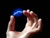 stock photo of discharge  - electric discharge in a hand against a dark background - JPG 