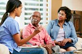 picture of home  - Nurse Making Notes During Home Visit With Senior Couple - JPG 