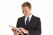 picture of business people  - Young businessman using a touch screen tablet type computer - JPG 