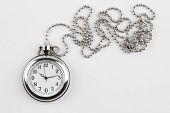 stock photo of watch  - Pocket watch and chain on plain background - JPG 
