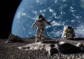 stock photo of future technology  - The astronaut on a background of a planet - JPG 