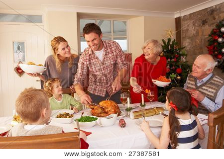 Picture or Photo of Family serving Christmas dinner