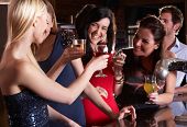 image of bar  - Young women drinking at bar - JPG 