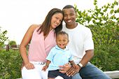 stock photo of family  - Happy African American Family Outdoor In Summer Sunny Day - JPG 