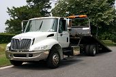 image of truck  - A white flatbed tow truck for towing  - JPG 