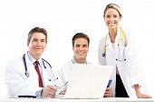 stock photo of medical doctors  - Smiling medical doctors with stethoscopes and laptop - JPG 
