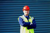 foto of construction worker  - construction worker with folded arms - JPG 