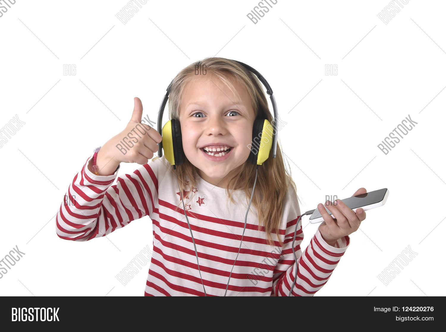 Sweet Little Girl 7 Years Old With Blonde Hair And Blue Eyes Sweet Little Girl 7 Years Old With Blonde Hair And Blue Eyes Listening To Music