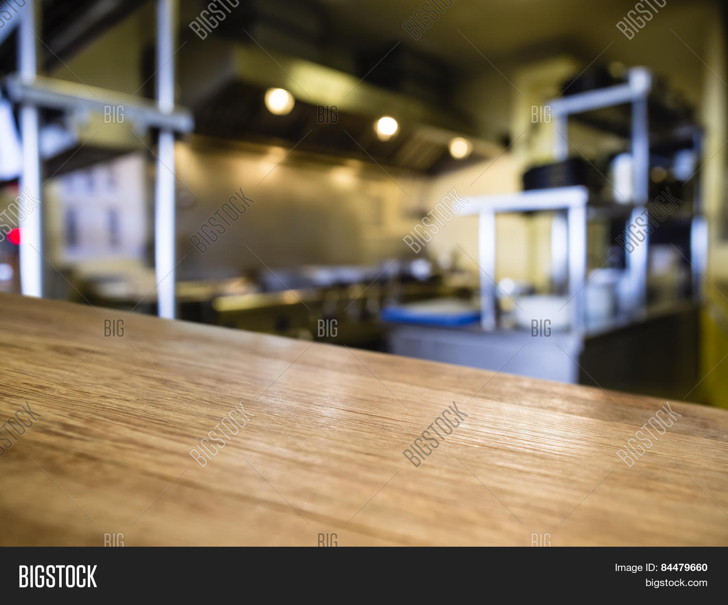 Restaurant Kitchen Background top of wooden table counter with blurred kitchen restaurant Restaurant Kitchen Background top of wooden table counter with blurred kitchen restaurant